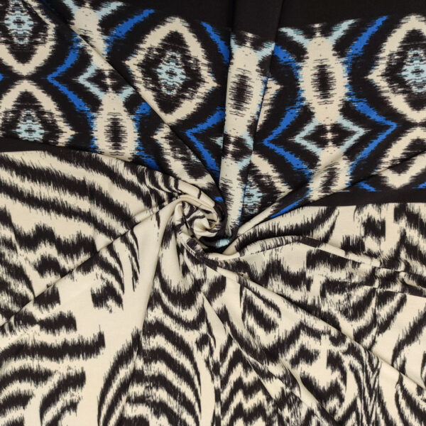 Tessuto Jersey a fantasia motivo astratto bianco - nero - blu elettrico