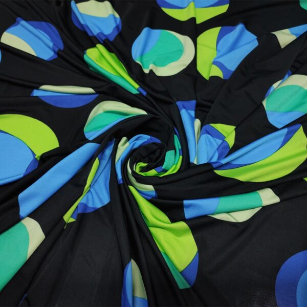 Tessuto Jersey a fantasia motivo pois nero - verde acido - turchese