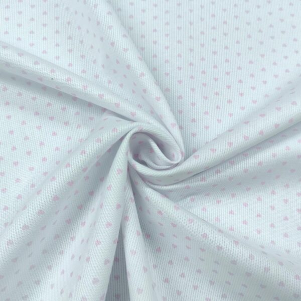 Tessuto Millerighe di Cotone a fantasia motivo cuori piccoli bianco - rosa