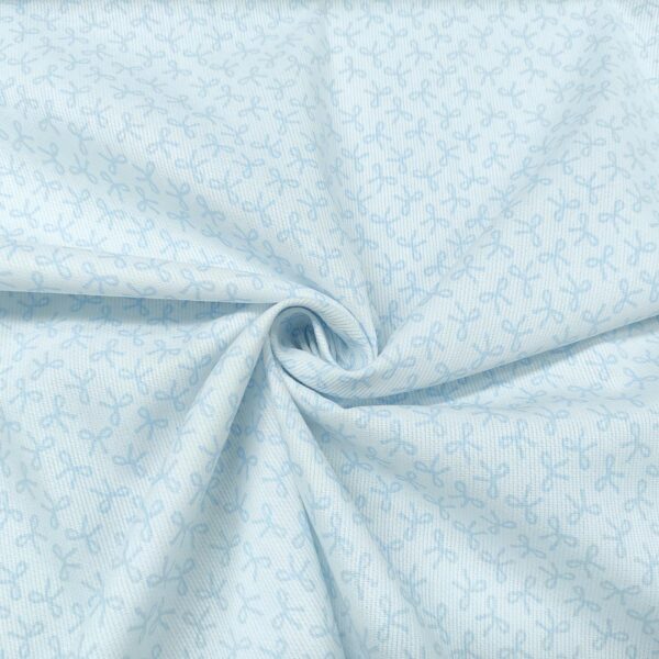 Tessuto Millerighe di Cotone a fantasia motivo fiocchi bianco - celeste