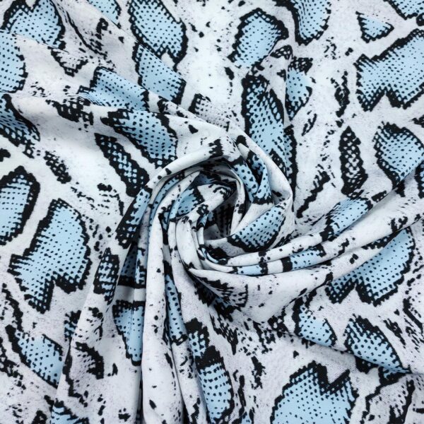 Tessuto Misto Viscosa a fantasia motivo animalier celeste - nero - bianco