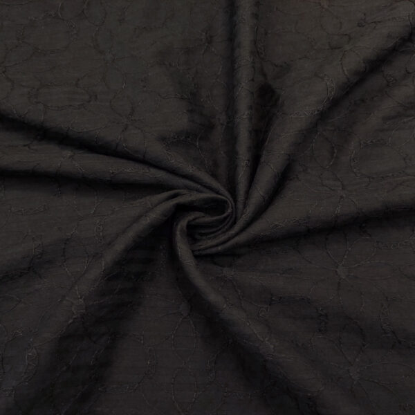Tessuto Mussola di Cotone ricamato tinta unita motivo floreale nero