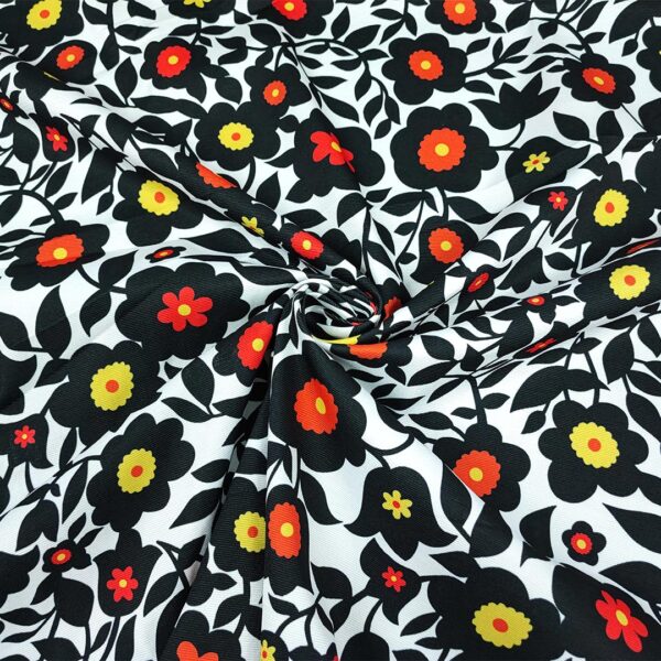 Tessuto Piquet di cotone a fantasia motivo floreale bianco - nero - arancione
