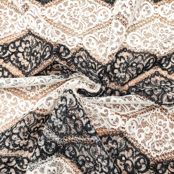 Tessuto Pizzo bicolore motivo floreale bianco - nero