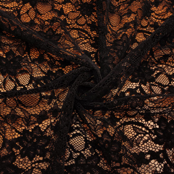 Tessuto pizzo con fiori in velluto tinta unita nero