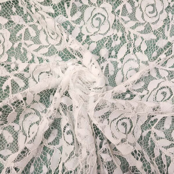 Tessuto pizzo elasticizzato motivo floreale bianco