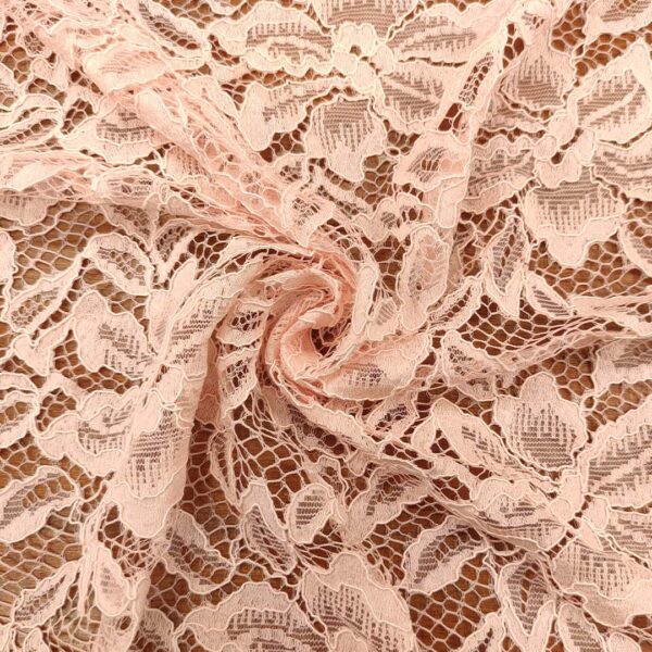 Tessuto pizzo motivo floreale rosa confetto