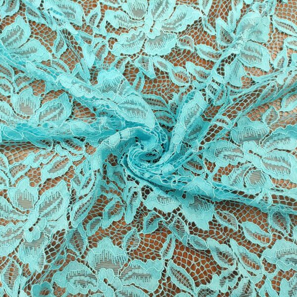 Tessuto pizzo motivo floreale turchese