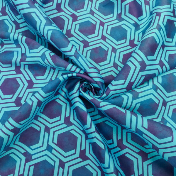 Tessuto Popeline di cotone a fantasia motivo geometrico turchese - blu