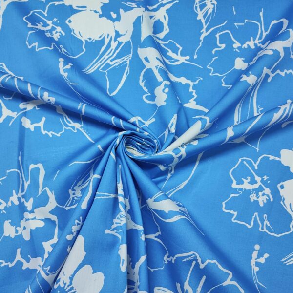 Tessuto Popeline di cotone a fantasia motivo floreale azzurro - panna