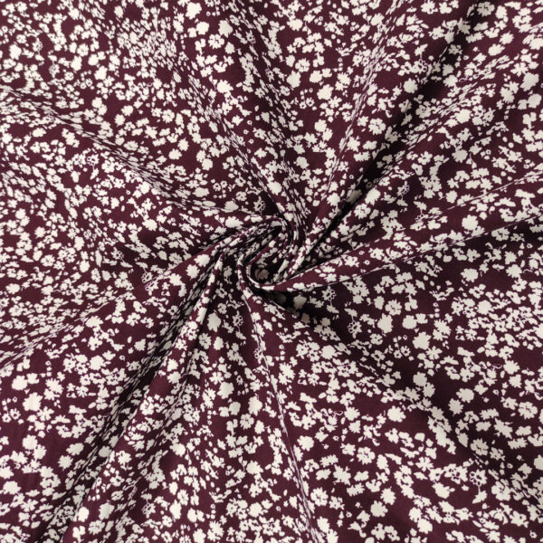 Tessuto Popeline di cotone a fantasia motivo floreale vinaccio - bianco