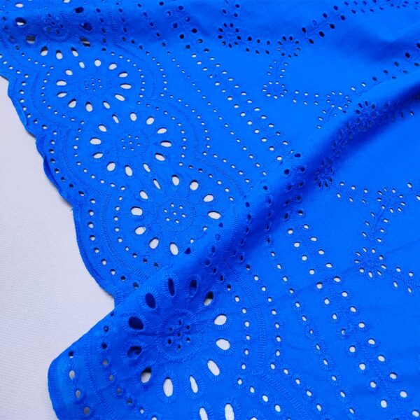 Tessuto Sangallo tinta unita motivo astratto bluette