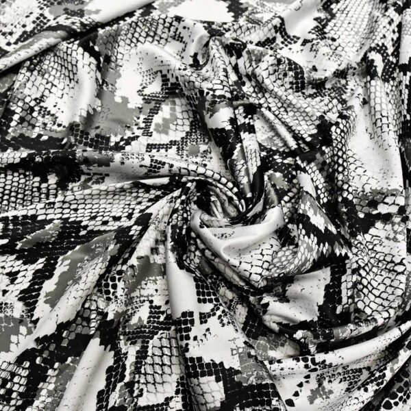 Tessuto Satin a fantasia motivo animalier bianco - nero