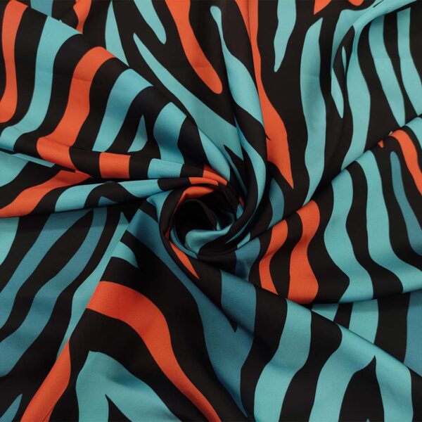 Tessuto Satin a fantasia motivo animalier nero - turchese - arancio