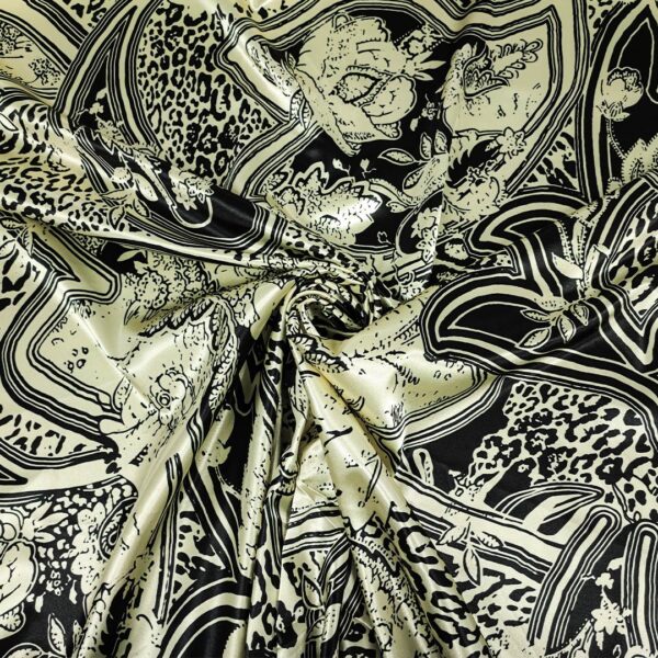 Tessuto Satin elasticizzato a fantasia motivo astratto giallino - nero