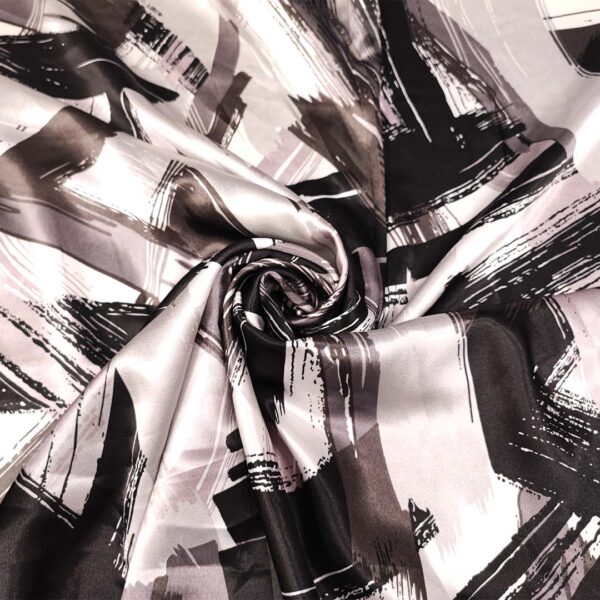 Tessuto Satin a fantasia motivo astratto nero - grigio