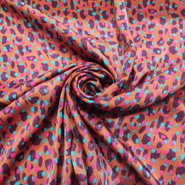 Tessuto Satin a fantasia motivo astratto ruggine - fucsia - vinaccio