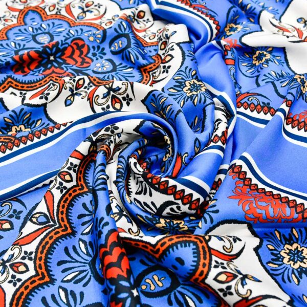 Tessuto Satin a fantasia motivo  astratto turchese - rosso - bianco