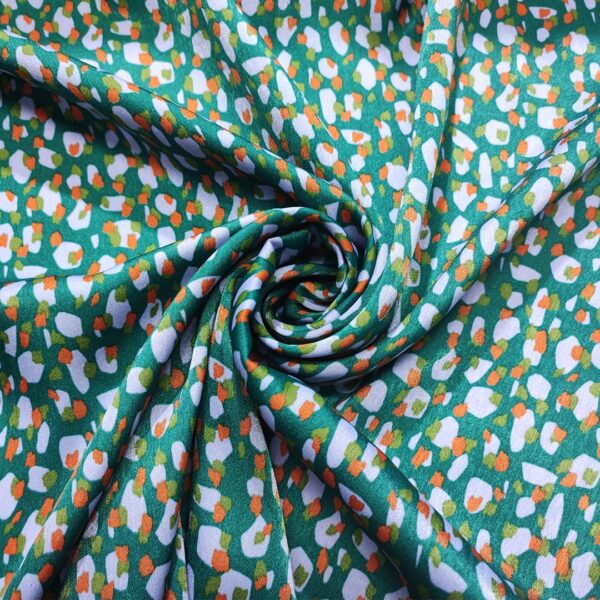 Tessuto Satin a fantasia motivo astratto verde petrolio - lilla - arancione
