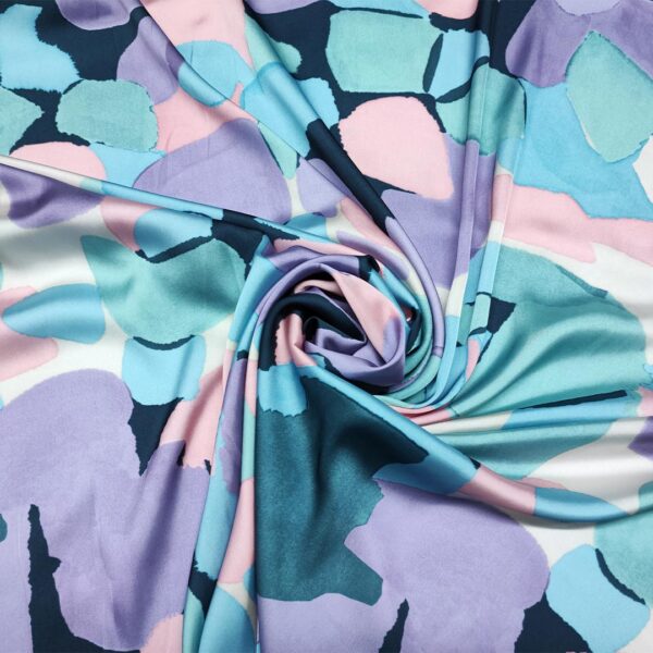 Tessuto Satin a fantasia motivo astratto verde petrolio - rosa - lilla