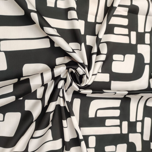 Tessuto Satin a fantasia motivo geometrico panna - nero