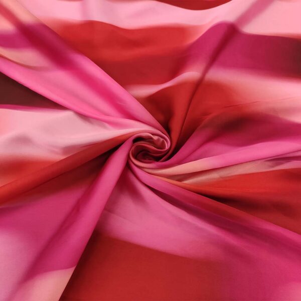 Tessuto Satin a fantasia motivo sfumato fucsia - rosa - arancio