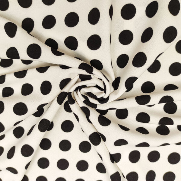 Tessuto Scuba Crepe a fantasia motivo pois bianco - nero