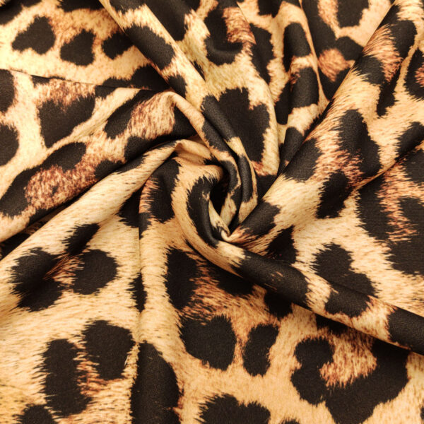 Tessuto Scuba Crepe a fantasia motivo animalier champagne - nero - marrone