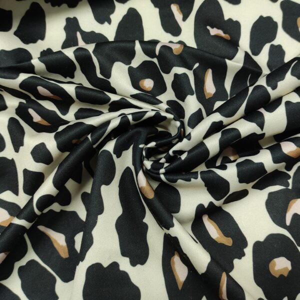 Tessuto Scuba Crepe a fantasia motivo animalier nero - beige - rosa