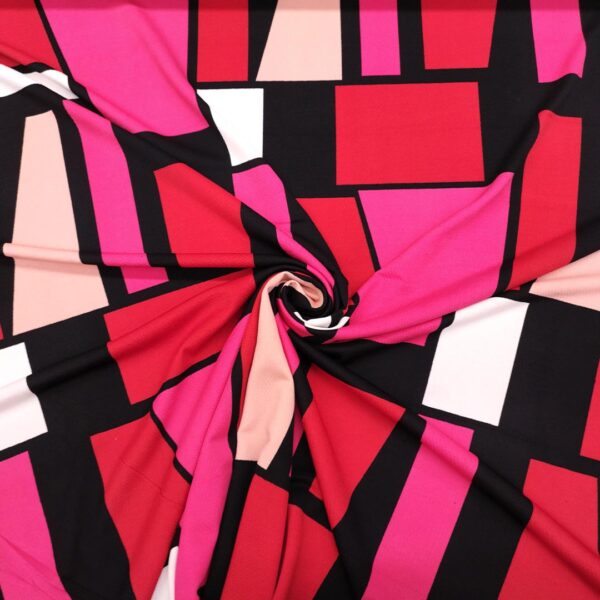 Tessuto Scuba Crepe a fantasia motivo astratto fucsia - rosso - nero