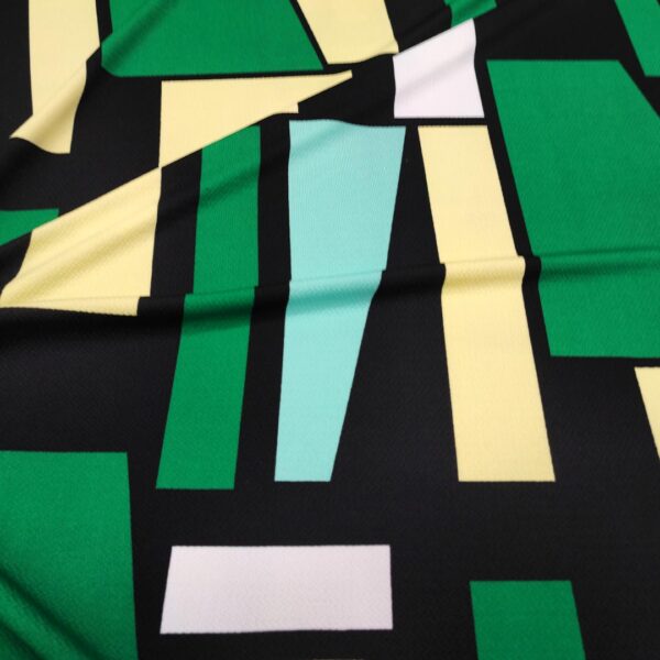 Tessuto Scuba Crepe a fantasia motivo astratto verde - giallo - nero - bianco