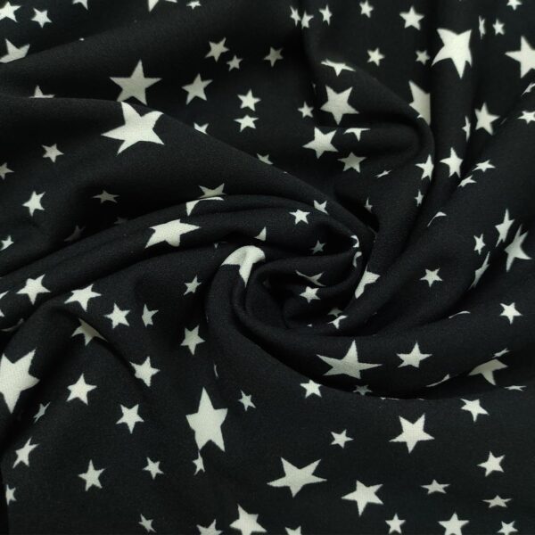 Tessuto Scuba Crepe a fantasia motivo astratto panna - nero