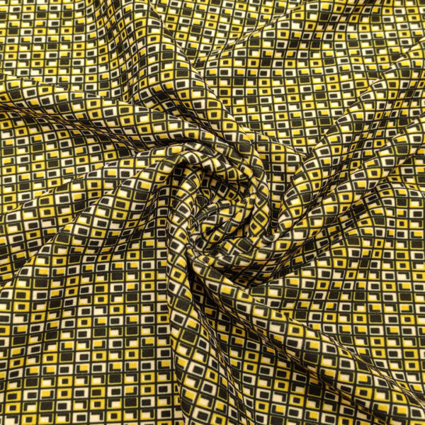 Tessuto Scuba Crepe a fantasia motivo geometrico nero - panna - giallo