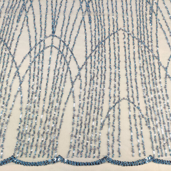 Tessuto Tulle mano seta ricamato con perline e paillettes motivo astratto azzurro