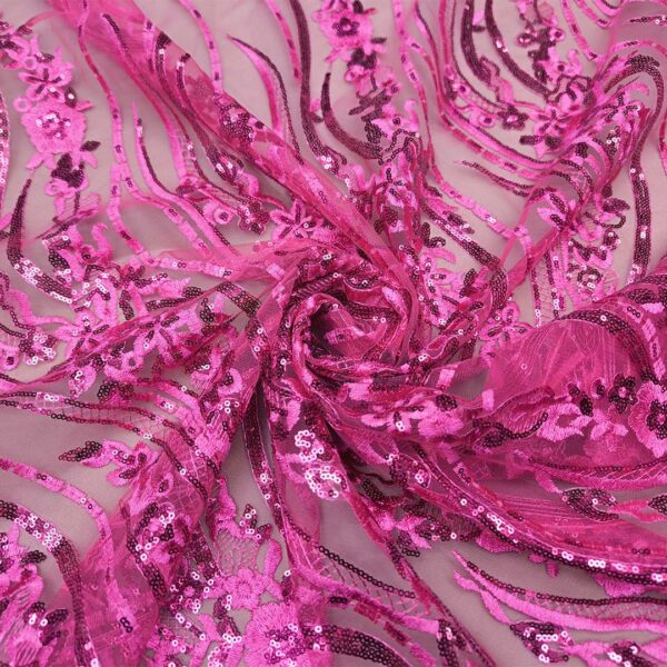 Tessuto Tulle ricamato doppio smerlo con paillettes motivo astratto fucsia