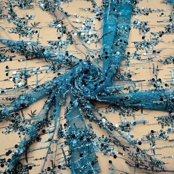 Tessuto Tulle ricamato con pietre e con paillettes motivo astratto ottanio