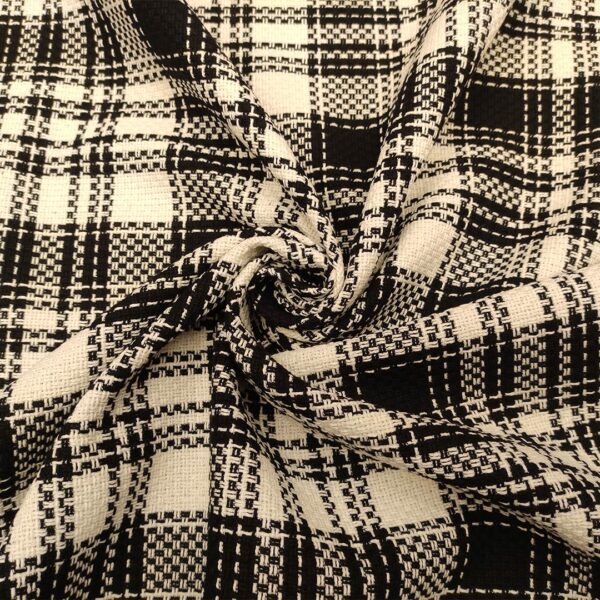 Tessuto Tweed Bouclé in cotone motivo quadri nero - bianco
