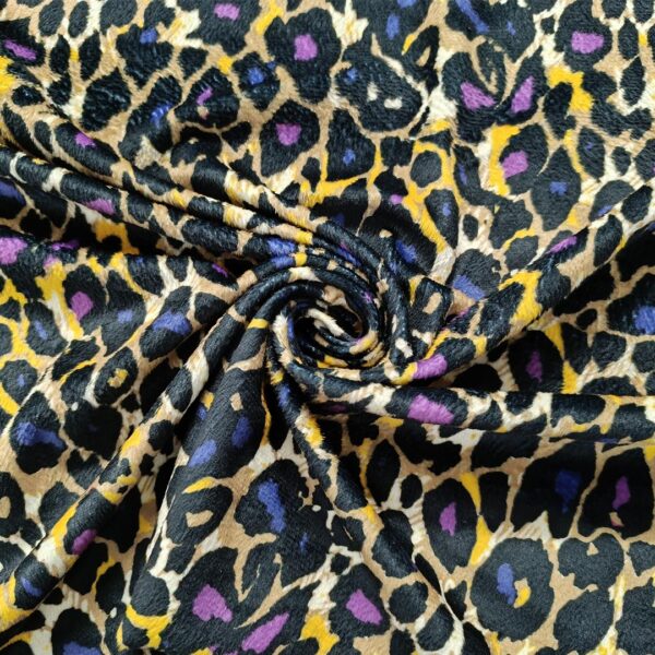 Tessuto Velluto elasticizzato a fantasia motivo animalier giallo - viola - nero