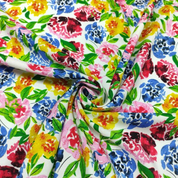 Tessuto Viscosa a fantasia motivo floreale bianco - giallo - rosa - blu