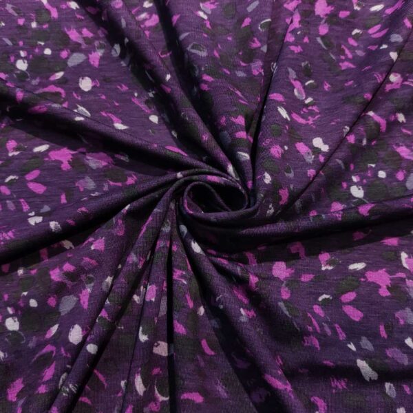 Tessuto Jersey di cotone a fantasia motivo astratto viola - nero - lilla