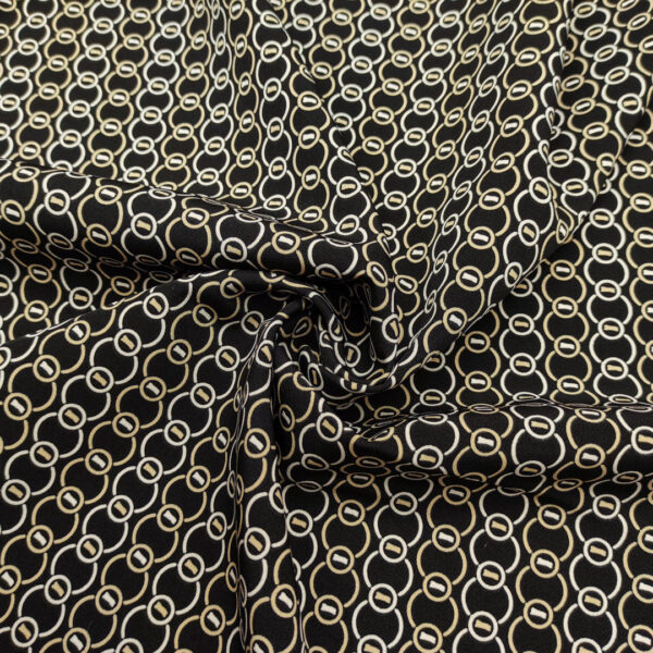 Tessuto Cady elasticizzato a fantasia motivo geometrico nero - beige