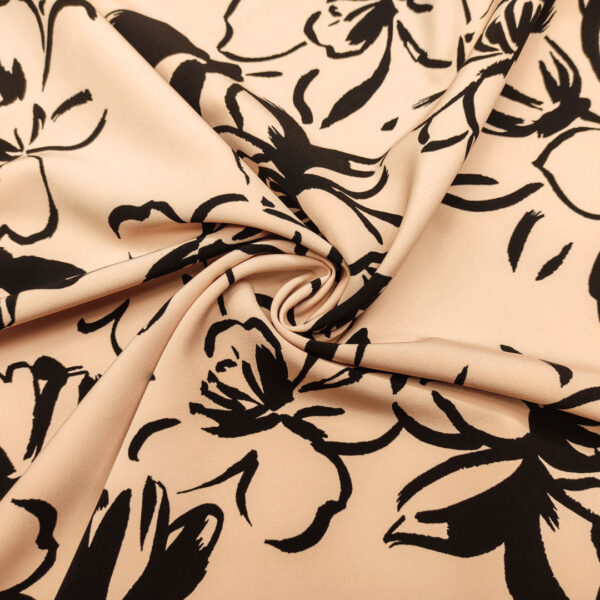 Tessuto Cady elasticizzato a fantasia motivo floreale rosa cipria - nero