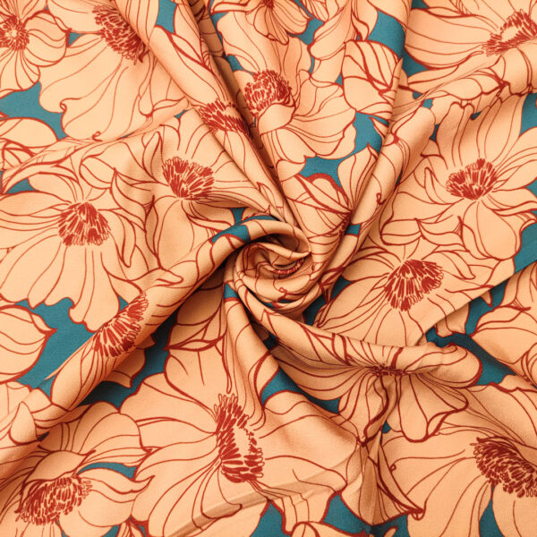 Tessuto Cady elasticizzato a fantasia motivo floreale pesco - turchese