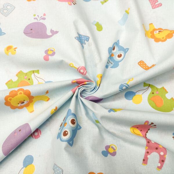 Tessuto Cotone percalle a fantasia motivo leoni celeste - giallo - verdino