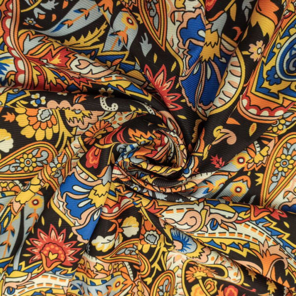 Tessuto Crepe elasticizzato a fantasia motivo floreale cashmere giallo - nero - arancione - blu