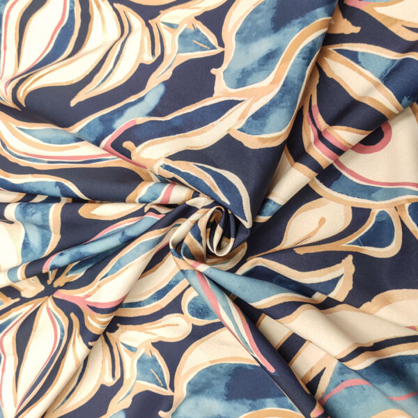 Tessuto Crepe elasticizzato a fantasia motivo astratto blu - celeste - beige