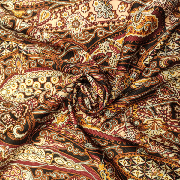 Tessuto Crepe elasticizzato a fantasia motivo floreale cashmere marrone - beige - arancio - bordeaux
