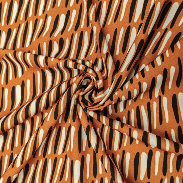 Tessuto Doppio Georgette a fantasia motivo astratto coccio - nero - panna