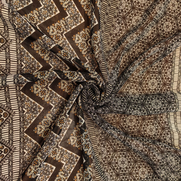 Tessuto Georgette a fantasia motivo astratto bianco - nero