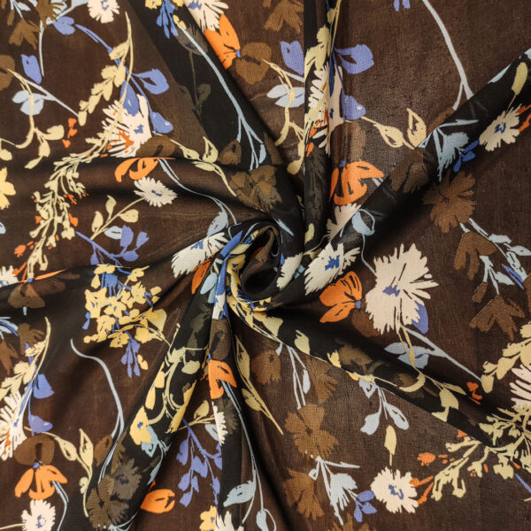 Tessuto Georgette a fantasia motivo floreale ruggine - very peri - nero